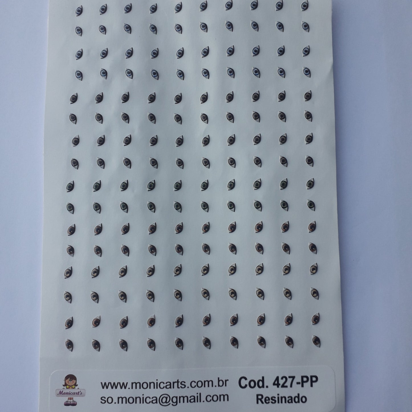 Ojitos adhesivos resinados Monicarts 427-PP en plancha