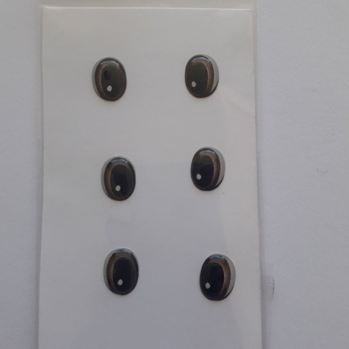 Ojitos adhesivos 3D  cafe obscuro ovalo