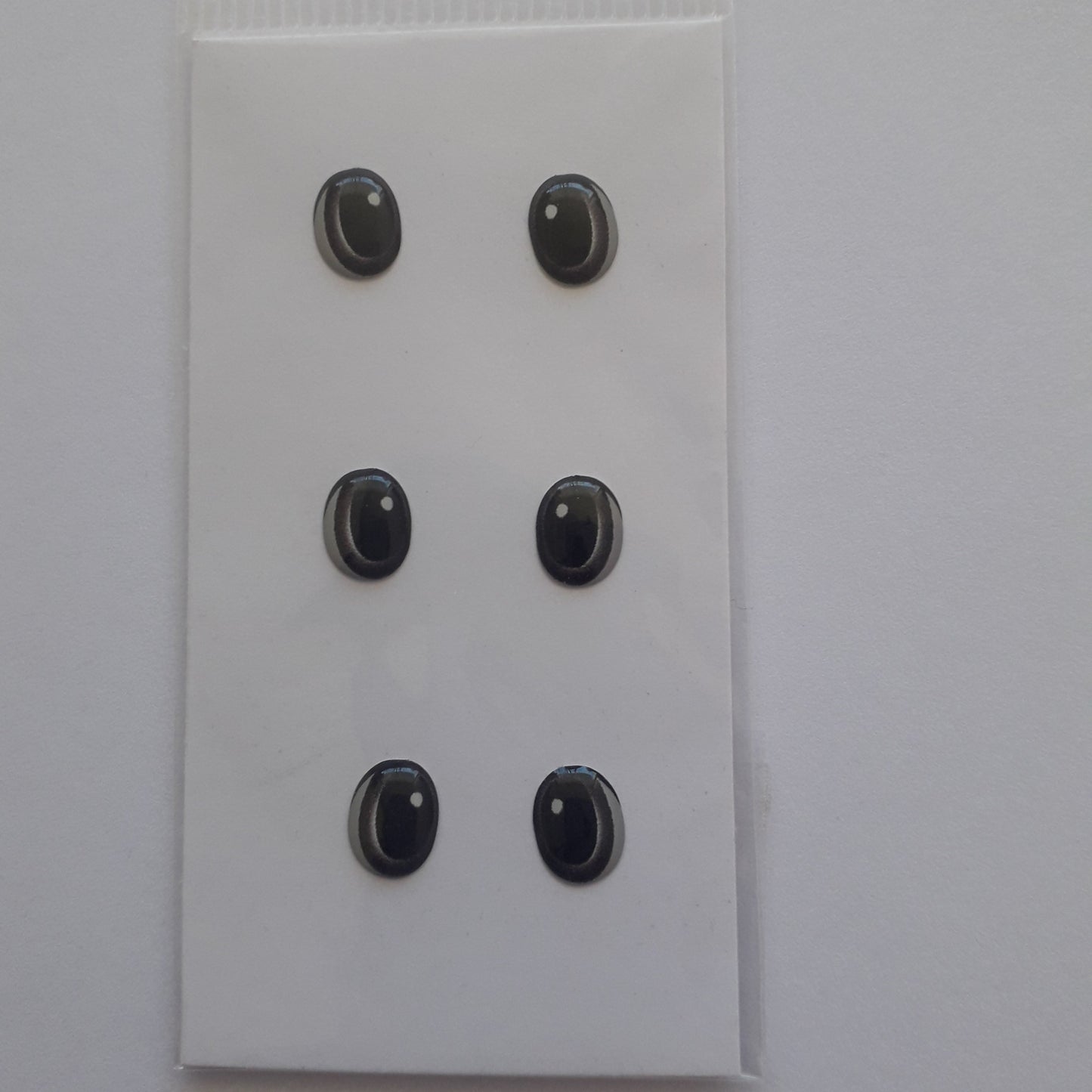 Ojitos adhesivos 3D  gris acero ovalo